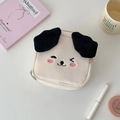 Detail of cute plush dog makeup bag with 3D ears and embroidered face on desk - Cartoon Dog Shape / Beige