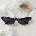 Cat eye sunglasses featuring tortoise shell leopard pattern frames with dark grey lenses - White Pattern/Dotted