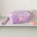 Detail of purple leopard print plush bag with soft texture and sturdy carry handle - Purple