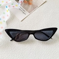 Retro black cat-eye sunglasses with dark grey lenses and a vintage pointed frame design - Black and Gray