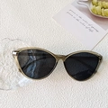 Translucent dark green cat-eye sunglasses with large resin frames and grey lenses - Transparent Green