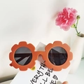 Matte orange sunflower shaped polarized kids sunglasses on a clean decorative card - Yellow