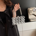 Modern clear acrylic beaded handbag with silver chain and metallic handle - Clear