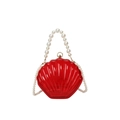 Translucent red shell crossbody bag with elegant white pearl beaded top handle strap - Transparent Red