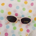 Pink cat-eye sunglasses for kids with grey lenses and UV400 protection on polka dot background - Pink Frame Grey Lens