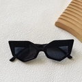 Polished black geometric cat-eye sunglasses with dark grey lenses in a retro modern style - Black and Gray