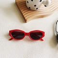 Stylish cat-eye sunglasses with thick red frames and dark lenses for a retro chic look - Red