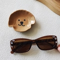 Brown oval sunglasses with rhinestone accents and hip-hop style in a variant display - Transparent Dark Tea
