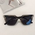 Retro grey translucent square frame sunglasses with dark round lenses in a flat lay view - Grey 26-Smoky Grey Translucent Round Sunglasses