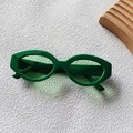 Vintage green cat-eye sunglasses with narrow resin frames and oval design for women - Green