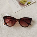 Occhiali da sole cat-eye con montatura tartarugata e lenti sfumate marrone rosso - Stampa leopardata