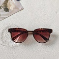 Retro tortoiseshell sunglasses with gradient lenses displayed on a clean white surface - Leopard Print
