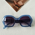 Deep blue geometric sunglasses with marble texture and purple gradient lenses - Transparent Blue