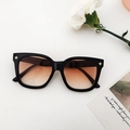 Chic square black frame sunglasses with gradient orange lenses and gold star detail - Black Frame Gradient Tea