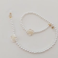 Detail of beaded eyewear chain with white resin rose charms and lustrous faux pearls - White Camellia