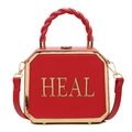 Modische rote achteckige Ledertasche mit HEAL-Goldbeschlägen und einem eleganten Griff - Rot