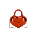 Glossy red acrylic heart-shaped handbag with matching top handle and gold chain strap - Red