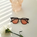 Chic black frame sunglasses with pink-orange gradient lenses and silver dot detail - Blush Gradient (2319)