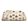 Creamy cylinder crossbody bag featuring silver hexagonal rivets and a wide lettered strap - White