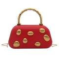 Artistic red pebble evening bag with gold oval accents and beaded handle - Red