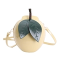 Detail of creative pear-shaped crossbody bag with glossy yellow finish and leaf accents - Pear/Apple Shape (Yellow) / Yellow