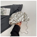 Close-up of a silver pleated clutch bag with metallic texture and chain strap details - Silver