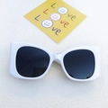 Retro white square frame sunglasses with black lenses shown on an aesthetic background - Porcelain White