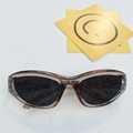 Y2K style wrap-around sunglasses with translucent brown frames and dark black lenses - Transparent Grey Green