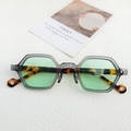 Irregular hexagonal sunglasses with grey transparent frame and green lenses in tortoiseshell - Clear Grey Green