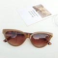 Cat eye sunglasses featuring translucent brown frames and leopard print temples - Brown with Patterned Temples