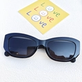 Chic black cat-eye sunglasses with rectangular frames and dark lenses for a modern style - Black and Gray