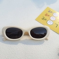 Retro cream white cat-eye sunglasses with dark lenses and minimalist oval frame style - Off White