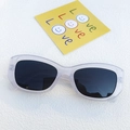 Minimalist cat-eye sunglasses with translucent light grey frames and dark tinted lenses - Clear White