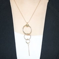 Modern gold long necklace with concentric rings and bar pendant on a female model - Metal Ball Three Layer Concentric Circle Long Bar Style (9#)