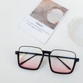 Fashionable black thick square frame sunglasses with gradient pink lenses on stone background - Black Frame Blush Lens