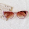 Cat eye sunglasses in translucent pink frame with gold metal accents and brown lenses - Purple