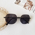 Detailed view of dark grey polygonal lens and black metal frame on kids sunglasses - Solid Grey