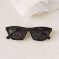 Macro shot of stylish thick-framed rectangular sunglasses in a dark glossy finish - Dark Grey