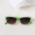 Close-up of bright grass green translucent frames on retro cat eye square sunglasses - Transparent Green Legs