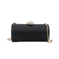 Matte black cylindrical acrylic evening clutch with large pearl clasp and gold chain strap - Black