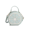 Cartoon lemon slice round shoulder bag in mint green and white with silver accents - Blue
