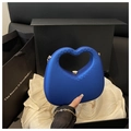 Detail of navy blue heart-shaped matte handbag with embossed texture in a gift box - Blue
