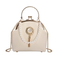Elegant off-white pearl handbag with round gold handle and metal tassel decoration - Pendant White