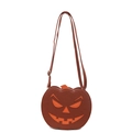Detailed texture of brown faux leather pumpkin crossbody bag with orange festive face - Brown