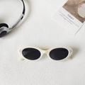 Retro oval sunglasses with off-white frames and black lenses on a white texture - Off White