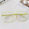 Occhiali quadrati in metallo verde neon con design a lettere FASHION traforate - Montatura Giallo Fluorescente Lente Trasparente