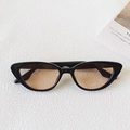 Cat eye sunglasses with black glossy frames and amber tinted lenses for women - Black Frame Blush Lens