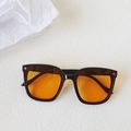 Oversized black frame sunglasses with orange gradient lenses and silver star accents - Black Frame Orange