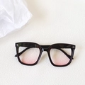 Chic black frame sunglasses with pink gradient lenses and metal star accents on frame - Black Frame Blush Pink
