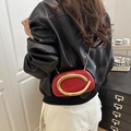 Chic red leather wristlet bag with large gold ring handle and chain strap - Red